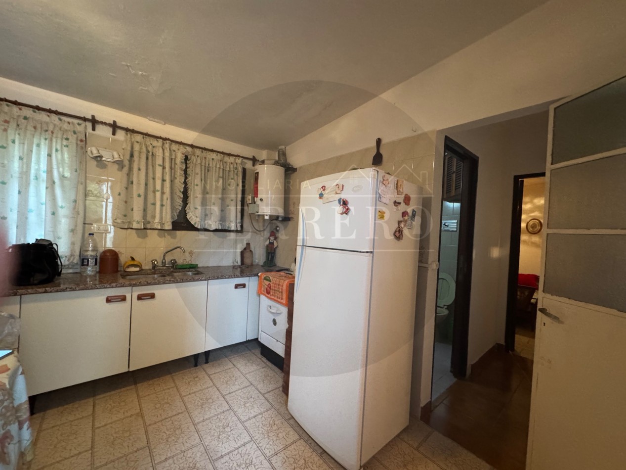Propiedad Multifuncional con Tres Espacios Habitables y Gran Lote de 1.100m2
